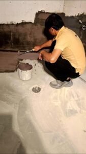 Teddy Tech technician applying waterproofing membrane