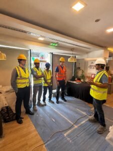 Site safety briefing for Little Lahore renovation team